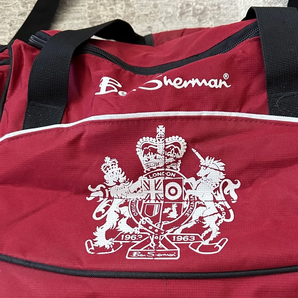 Ben Sherman Burgundy Duffel Bag with Black Accents.